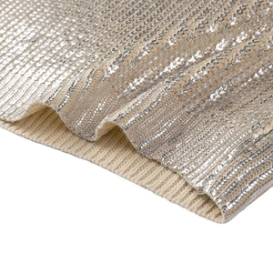 Women's beige crewneck sweater with sparkling silver sequins in a vertical striped pattern