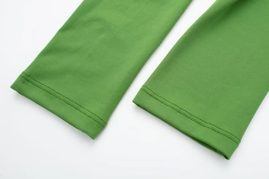 Detail of double-needle stitching on elastic grass green long sleeve cuff
