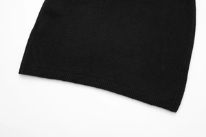 Detailed macro view showing the high-quality ribbed knit texture on the black sleeve cuff