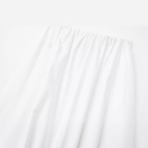Élégante jupe midi blanche ample avec taille élastique large et texture plissée douce