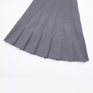 Fashionable grey pleated mini skirt with elegant wide accordion folds and smooth texture