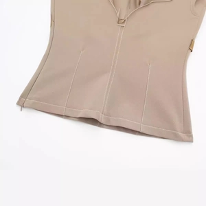 Women's khaki vest top with white contrast stitching, side zipper, and waist detailing