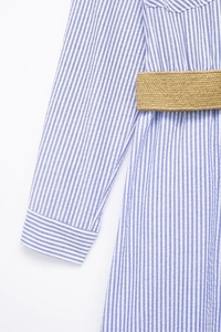 Detail of blue and white striped shirt dress featuring a khaki braided belt at the waist