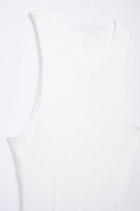 Close-up of white sleeveless ribbed knit top featuring a round neck and size L label