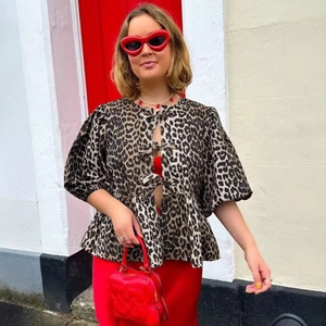 Women's leopard print blouse with black bow ties and stylish puff sleeves