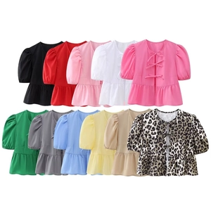 Multiple color options for puff sleeve tops with triple bow ties and ruffled hem detail