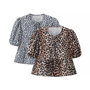 Women's leopard and abstract print short sleeve blouses with tiered ruffle hem