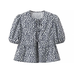 Blue and white floral print blouse with puff sleeves and front ribbon bow ties