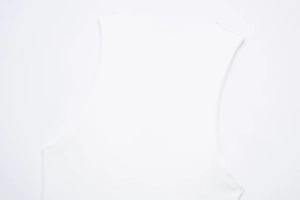 Close-up of white sleeveless top showing round neck design and knit fabric texture