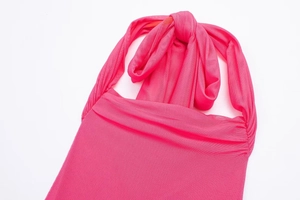 Detail of rose pink mesh halter neck dress showing breathable fabric texture and knot