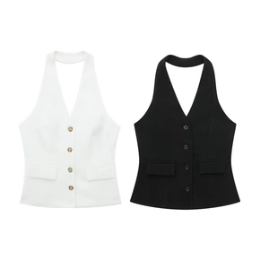 Detailed view of backless halter vests in white and black with neat button closure
