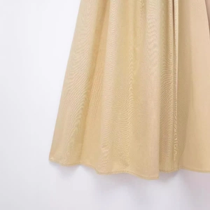 Elegant champagne gold maxi dress with metallic shimmer and premium draped fabric detail