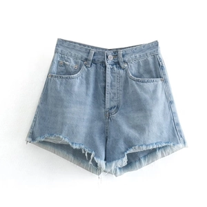 Detail view of light blue denim shorts with high waist cut and frayed raw hem texture