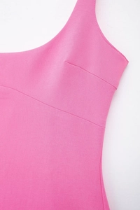 Detail of rose pink slim fit dress showing seamless neckline and premium fabric texture