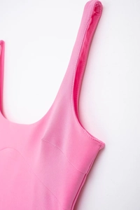Detailed view of pink bodycon dress featuring premium stitching and precise seam lines