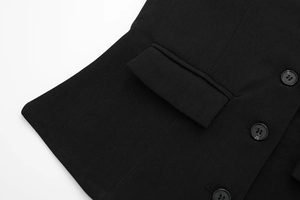 Detailed macro view of black vest pocket and three buttons with premium woven texture