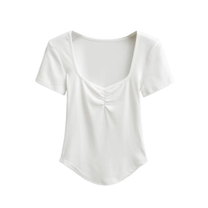 Detail of white ribbed crop top featuring front ruched chest and curved hemline