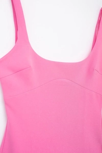 Close-up of pink slim-fit bodycon dress with U-neckline and structural bust stitching