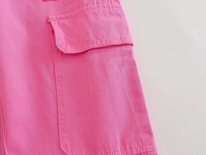 Detail of cargo flap pocket on pink straight trousers with reinforced double stitching