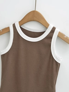 Detail of coffee brown ribbed knit tank top with white contrast edging on neckline