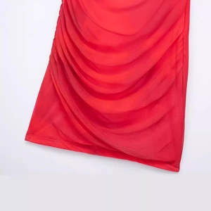 Women's red halter neck mesh dress with elegant side ruching and pleated hem detail