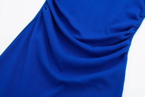 Close-up of ruched side details on Royal Blue ribbed slim dress with knit texture