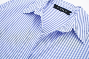 Detail of blue and white striped poplin shirt collar with high-quality stitching