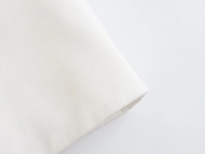 Detailed macro view of high-quality white heavy cotton canvas with tight plain weave texture