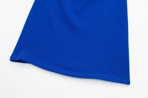 Close-up of royal blue ribbed knit dress hem showing fine stitching and premium fabric texture