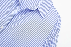 Close-up of the classic blue and white striped poplin shirt collar with button detail