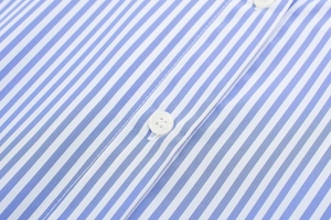 Detail shot of vertical blue and white stripes with high-quality white resin buttons