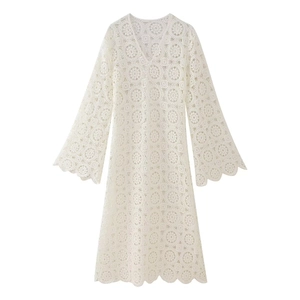 Elegant white crochet lace midi dress with V-neck and bell sleeves on a plain background