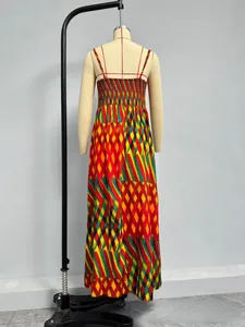 Detail of bohemian smocked bodice with colorful geometric print on a long dress