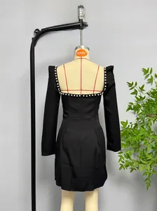 Detail showing square neck back with white pearl trim on a black long sleeve mini dress