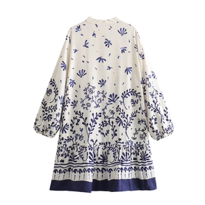 French style cream long sleeve mini dress with dark blue floral print and ruffled hemline
