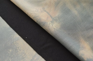 Close-up of breathable mesh fabric and colorful print detail on the summer dress