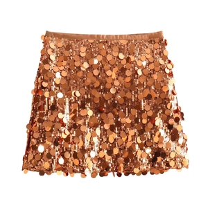 Close-up of sparkling rose gold sequins and satin waistband on this A-line mini skirt