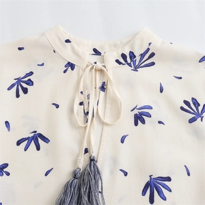Floral print long sleeve mini dress with tie-neck stand collar and blue tassels