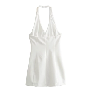 Detail view of smooth white satin fabric and hidden side zipper on a halter neck dress