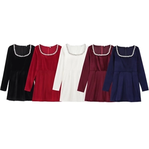 Detail of velvet A-line mini dress showing U-neck with sparkling rhinestone trim accents