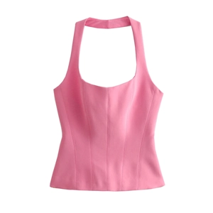 Detail view of pink corset crop top with halter neck and structural seams for slim fit