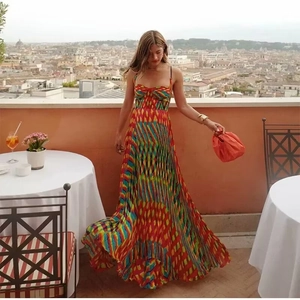 Elegant pleated maxi dress with colorful abstract print and thin straps for vacation