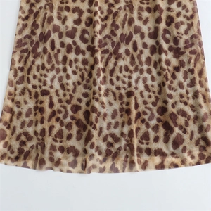 Close-up of lightweight leopard print mesh fabric on a summer slip dress for women
