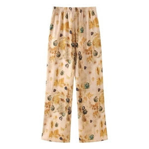 Women's vintage floral wide-leg trousers with realistic leaf print in beige and caramel