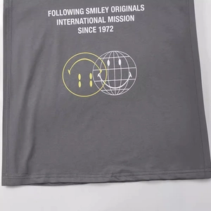Dark grey crew neck T-shirt with vintage yellow and white smiley face graphic prints
