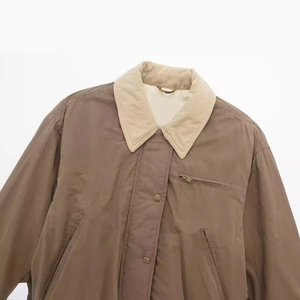 Brown vintage bomber jacket with white corduroy collar and zip pocket detailing