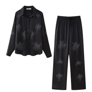 Women's 2-piece black satin lounge set with silver palm tree embroidery and drawstring pants