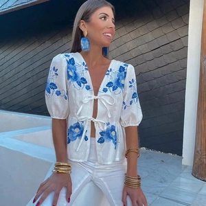 White linen shirt with blue floral embroidery and front bow ties for women