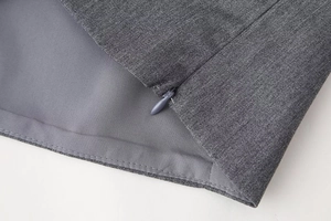 Detail of the high-quality invisible zipper on a grey satin printed camisole top