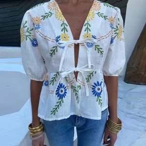 Summer linen blouse for women featuring daisy embroidery and stylish front bow ties